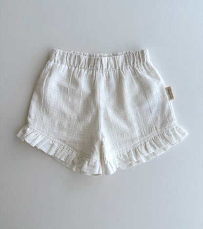 Organic cotton muslin shorts | Pomegranate | Flowers